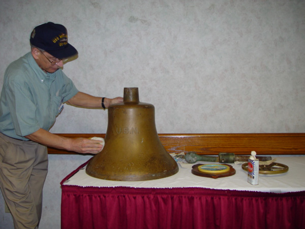 Roger Ballard shining the Mullinnix Bell @ 2003 Reunion